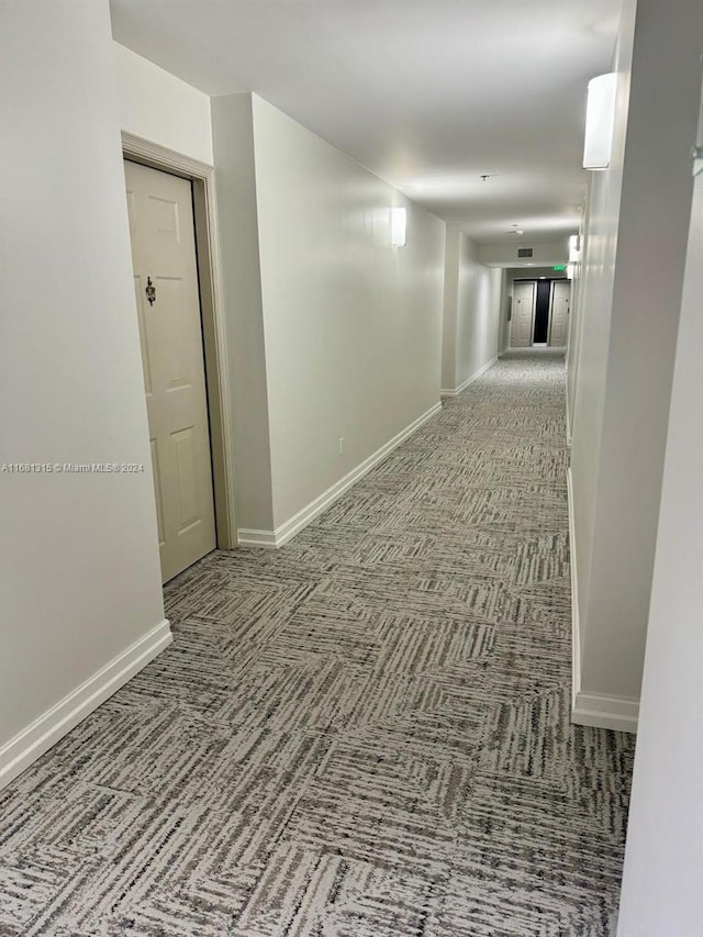 hall with carpet floors