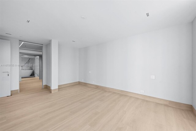 bedroom with light hardwood / wood-style floors