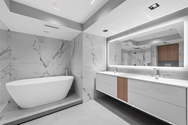 bathroom with vanity and a bathing tub