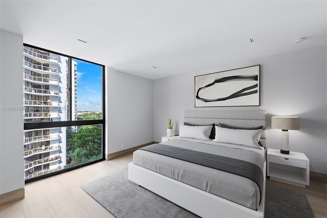 bedroom featuring expansive windows