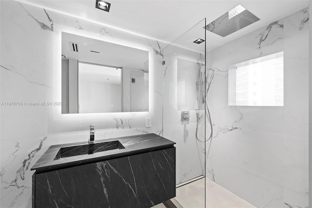 bathroom featuring vanity and a shower