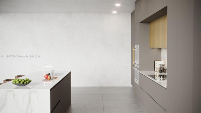 kitchen featuring gray cabinets and black electric cooktop