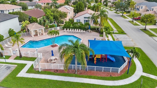 view of pool featuring a patio and a playground