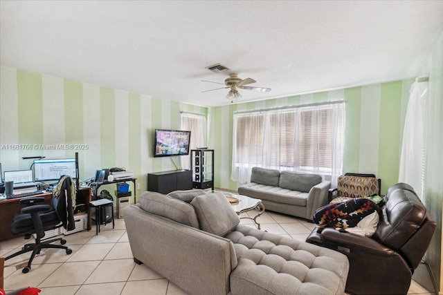 living room featuring light tile patterned floors and ceiling fan