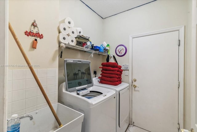 washroom featuring washer and dryer