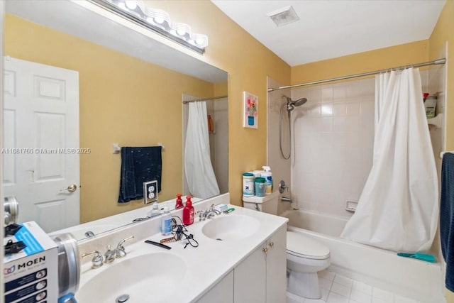 full bathroom with vanity, shower / tub combo with curtain, toilet, and tile patterned floors