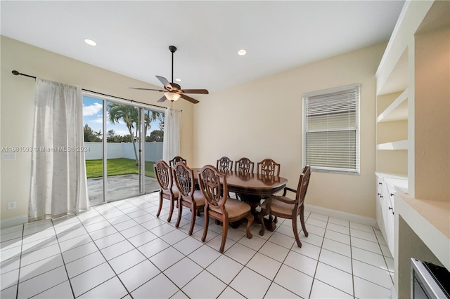 tiled dining area featuring ceiling fan