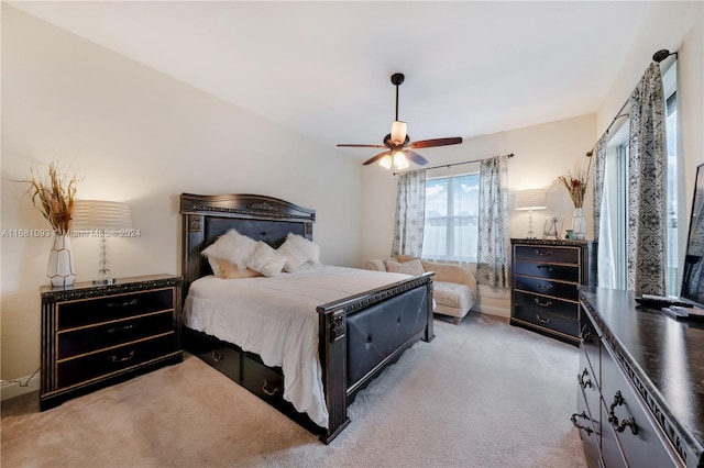 bedroom with light colored carpet and ceiling fan