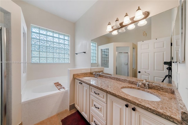 bathroom with vanity and separate shower and tub