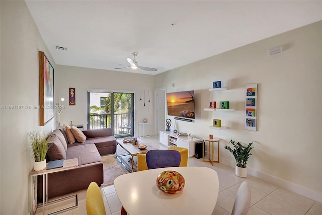 living room featuring ceiling fan and light tile patterned flooring