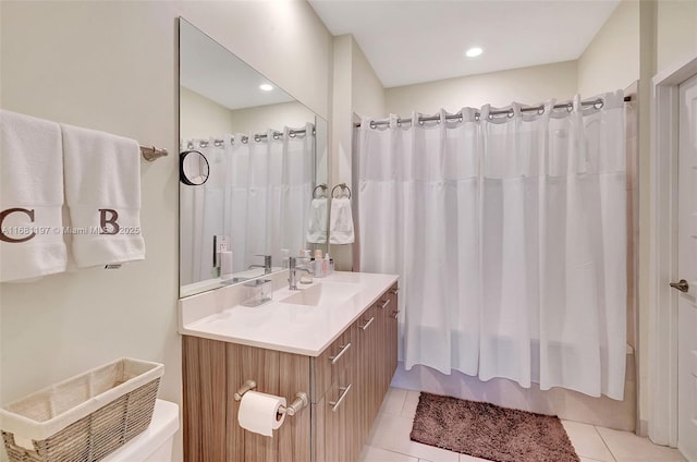 full bathroom with toilet, vanity, tile patterned floors, and shower / tub combo with curtain