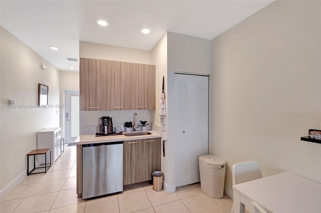 kitchen with dishwasher, light tile patterned flooring, sink, and fridge