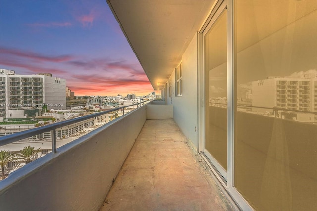 view of balcony at dusk