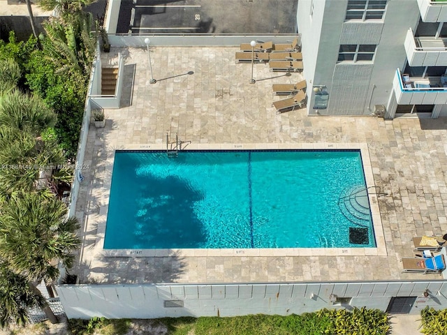 view of swimming pool with a patio