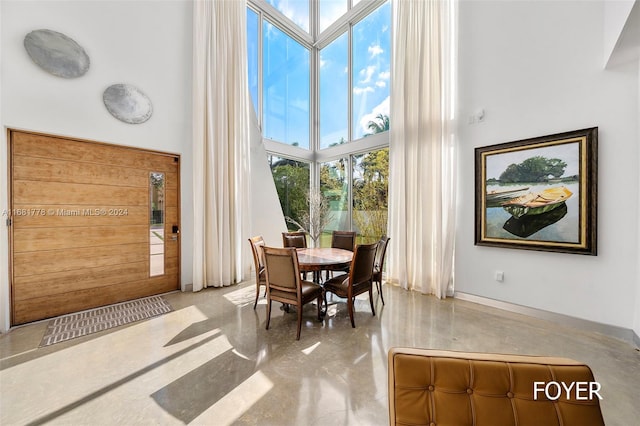 sitting room featuring a towering ceiling