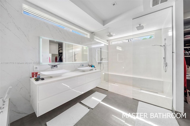 bathroom featuring vanity and a shower