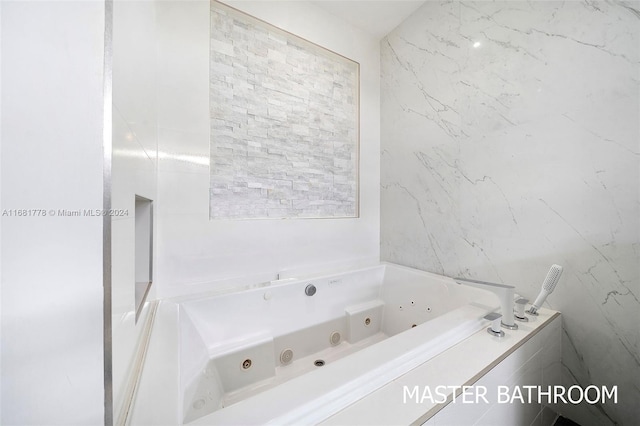 bathroom featuring a relaxing tiled tub