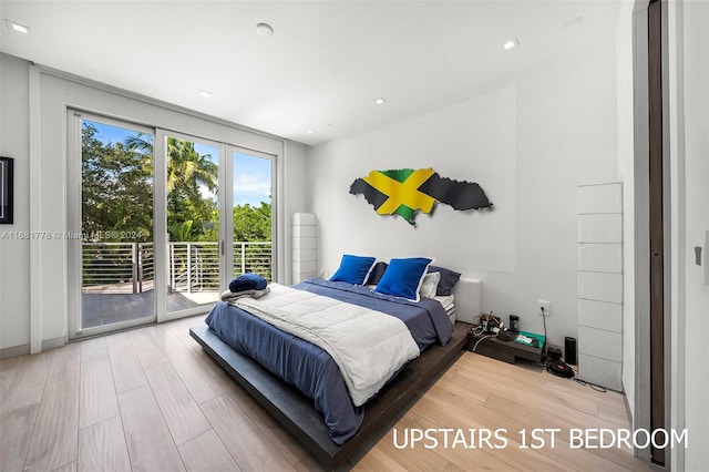 bedroom featuring access to exterior and hardwood / wood-style flooring