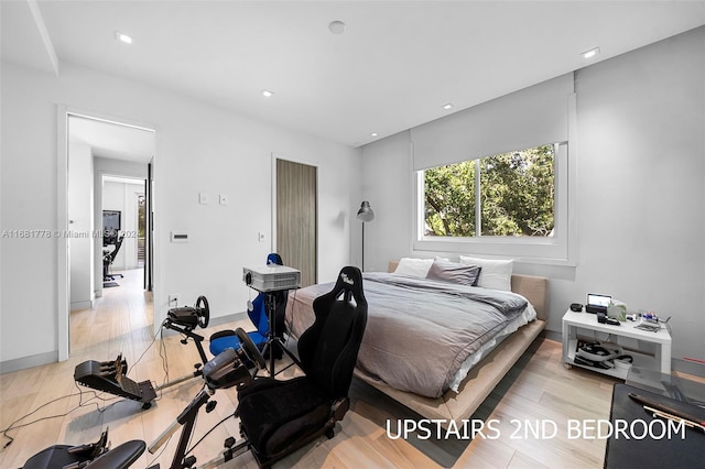 bedroom with light hardwood / wood-style floors