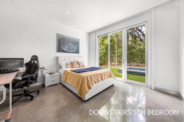 bedroom with concrete flooring and access to outside