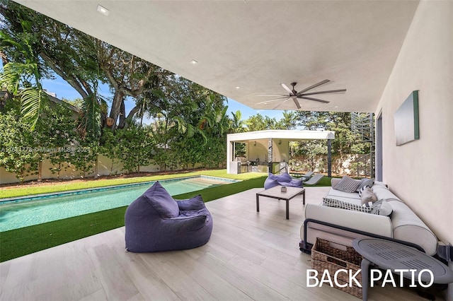 view of patio featuring an outdoor living space and ceiling fan