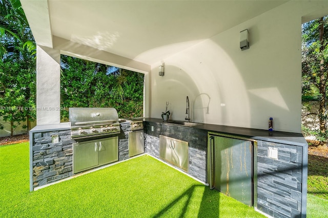 view of patio / terrace featuring an outdoor kitchen, a grill, sink, and beverage cooler