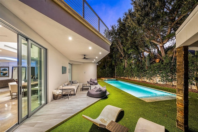 view of swimming pool with a yard, an outdoor hangout area, and a patio area