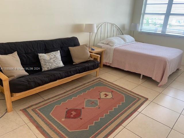 bedroom with tile patterned floors