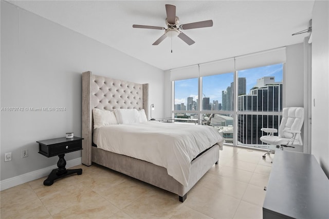 bedroom featuring ceiling fan, light tile patterned flooring, and multiple windows