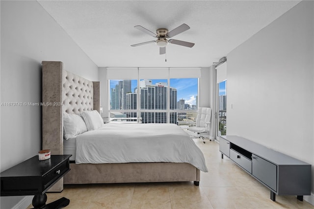 bedroom with a textured ceiling and ceiling fan