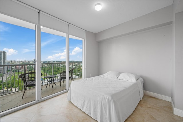 bedroom featuring access to outside and light tile patterned floors