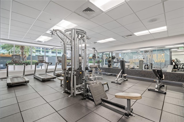 workout area with a drop ceiling