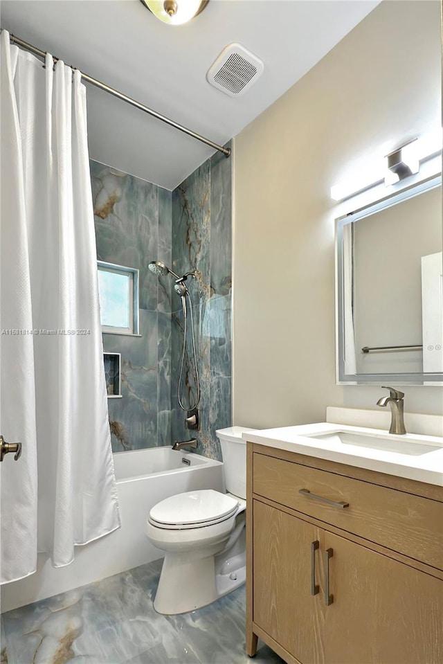 full bathroom featuring shower / tub combo with curtain, vanity, and toilet