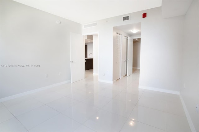 spare room with light tile patterned floors