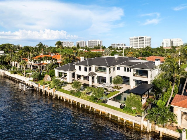 birds eye view of property with a water view