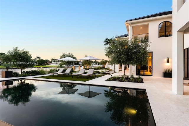 exterior space featuring a patio area and a swimming pool