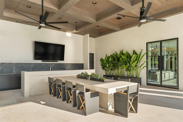 view of patio / terrace featuring a bar and ceiling fan