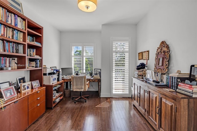 office with dark hardwood / wood-style floors