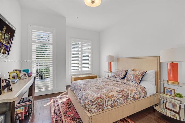 bedroom featuring dark hardwood / wood-style flooring