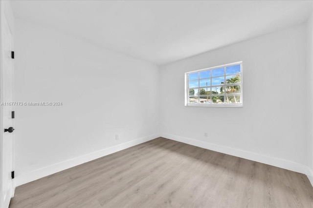 unfurnished room with light hardwood / wood-style flooring