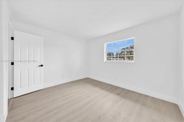 spare room with light wood-type flooring