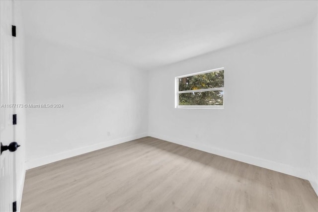 spare room featuring light hardwood / wood-style floors