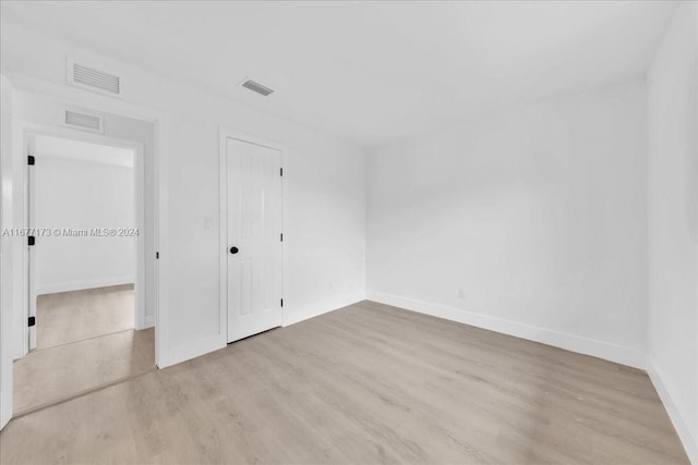 unfurnished room featuring light wood-type flooring