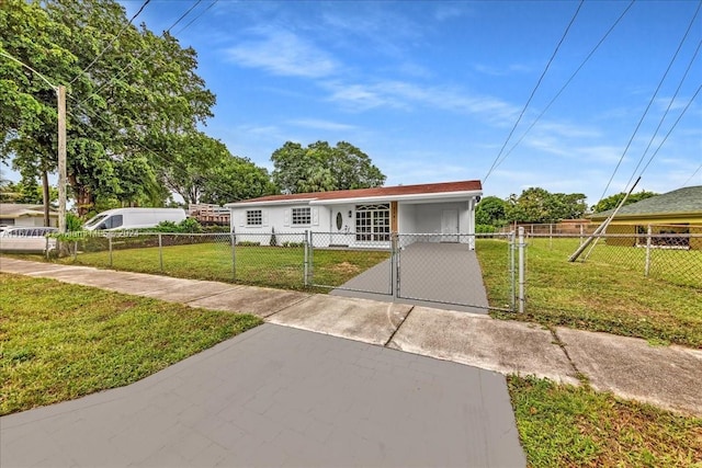 view of front of property with a carport and a front yard