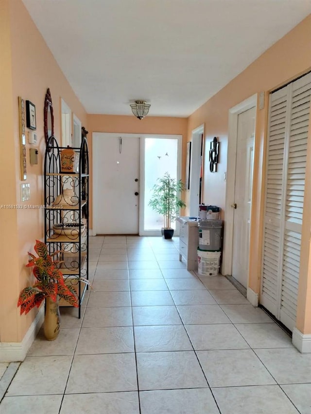 foyer featuring light tile patterned floors