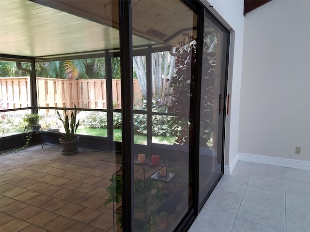 unfurnished sunroom featuring plenty of natural light