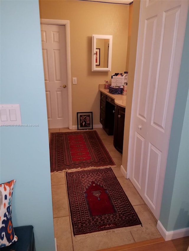 bathroom with tile patterned floors and vanity