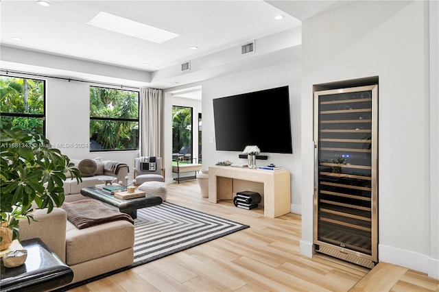 living room featuring light hardwood / wood-style flooring and wine cooler