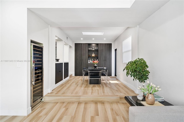 kitchen featuring hardwood / wood-style floors and wine cooler