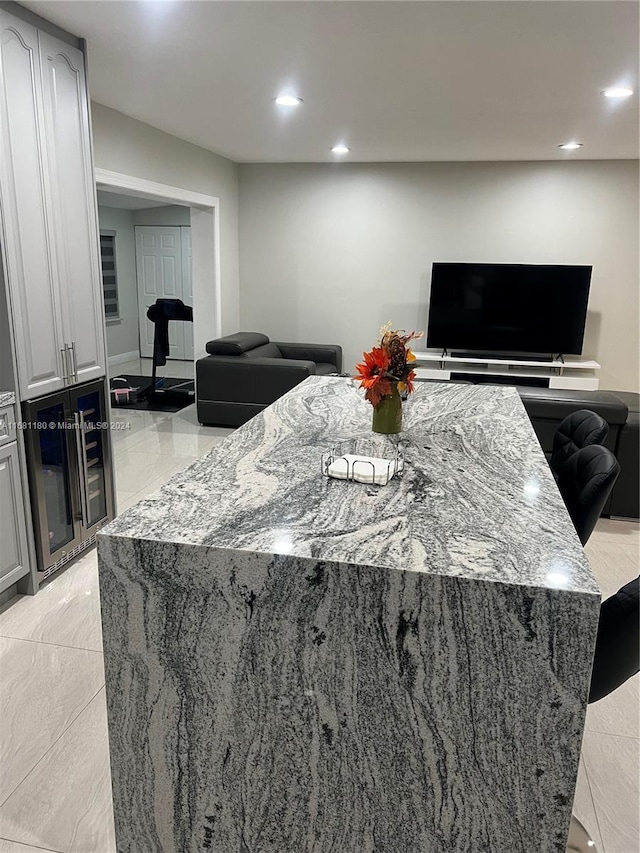 kitchen with light stone countertops and a center island